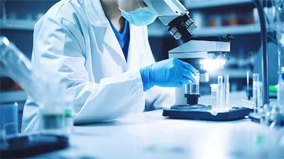 Scientist analyzing samples using a microscope in a research laboratory